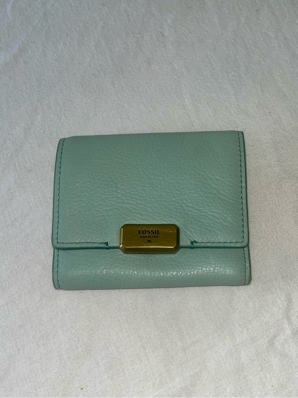 Fossil issue no 1954 seafoam colored trifold wallet